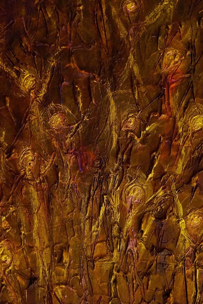 Detail of one of my paintings: dark gold and copper, thick with texture, with glowing shapes rising through it.